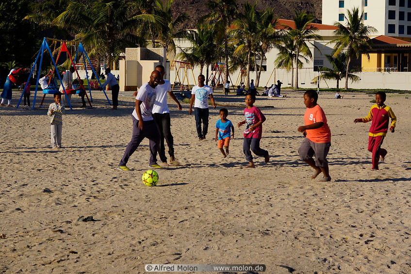 10 Playing football on the beach