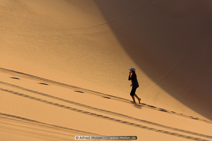 04 Girl walking on sand dunes