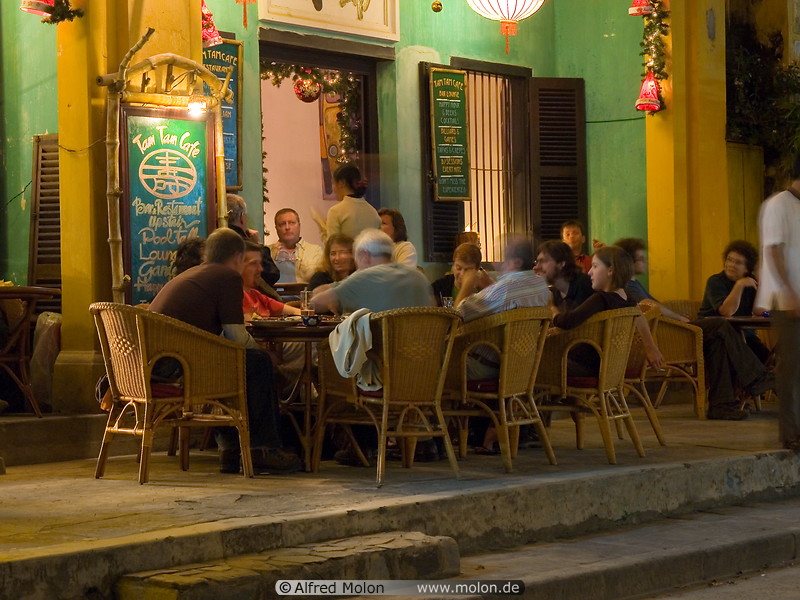 17 Tourists sitting in cafe at night