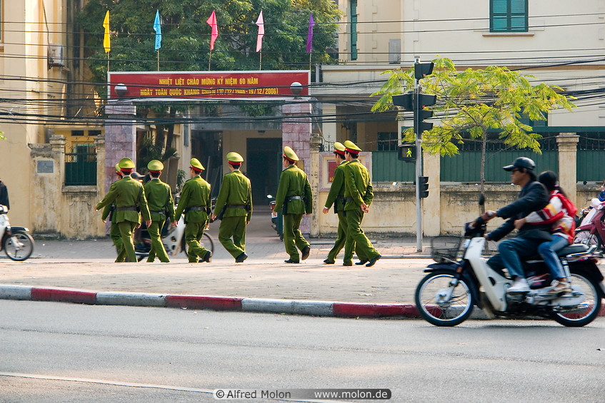 11 Vietnamese soldiers walking on the street