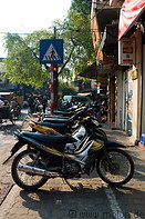 12 Motorbikes parked on pavement